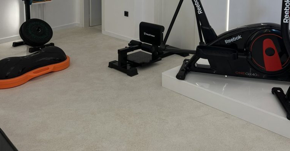 Terrazzo Granitech microtopping floor in home gym showing seamless matte finish and durability compared to epoxy flooring
