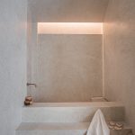 Terrazzo Granitech Microterrazzo 600Q resin plaster with embedded aggregates, crack-resistant finish.