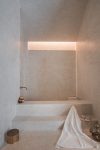 Terrazzo Granitech Microterrazzo 600Q resin plaster with embedded aggregates, crack-resistant finish.