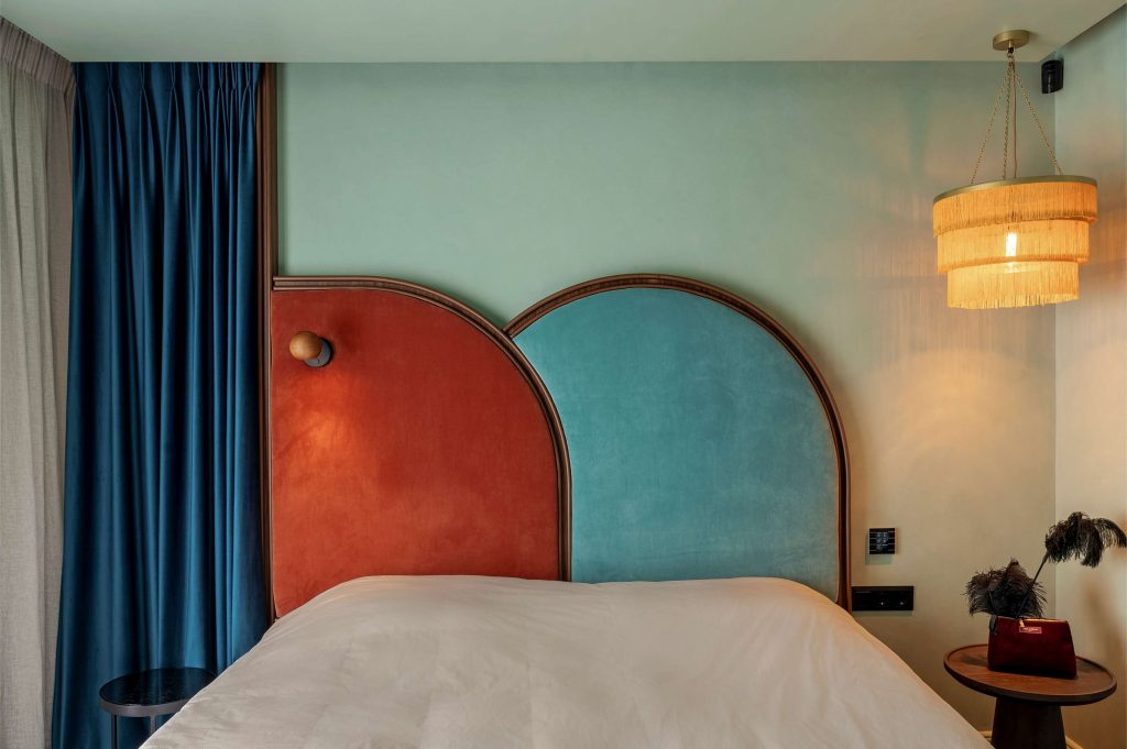 Terrazzo Granitech resin microtopping with anti-slip matte PU sealer on hotel bedroom walls in mint green finish.