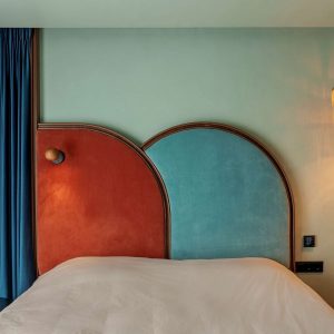 Terrazzo Granitech resin microtopping with anti-slip matte PU sealer on hotel bedroom walls in mint green finish.