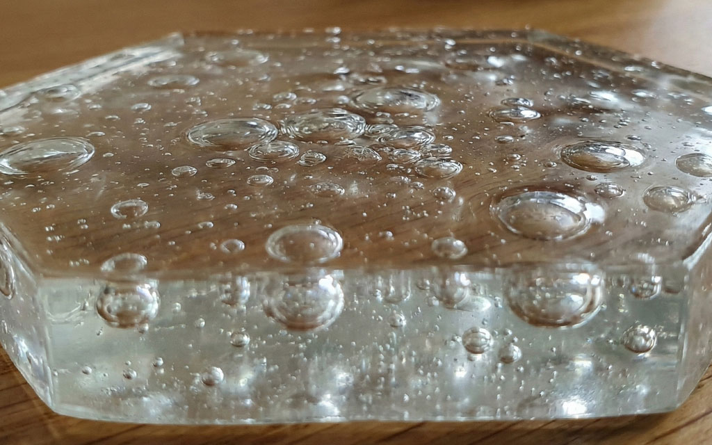 Air bubbles trapped in epoxy resin causing clarity defects and surface imperfections