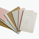 Terrazzo Granitech Medium finish color sample chips in pink, gold, gray, and white.