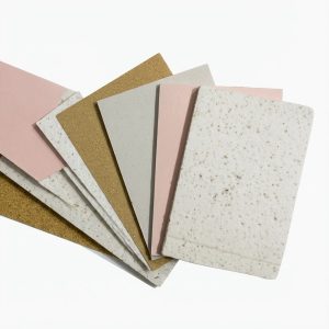 Terrazzo Granitech Medium finish color sample chips in pink, gold, gray, and white.