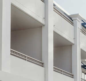 Building facade finished with Terrazzo GraniTech, a modern and durable option among types of exterior wall finishes.